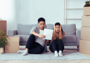 man showing his shocked wife eviction notice